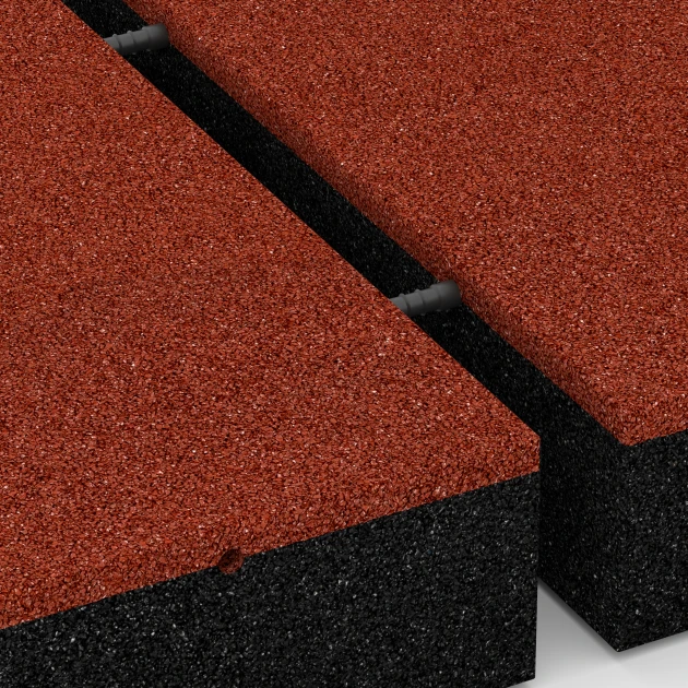 Großaufnahme vom Verbindungssystem von WARCO-Boden 6278 - Playground Safety Tile – 300 cm im Farbdesign Brick red. Abmessungen 50 x 50 x 11 cm.